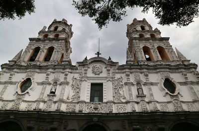 Low angle view of old building against sky