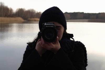 Woman photographing through smart phone