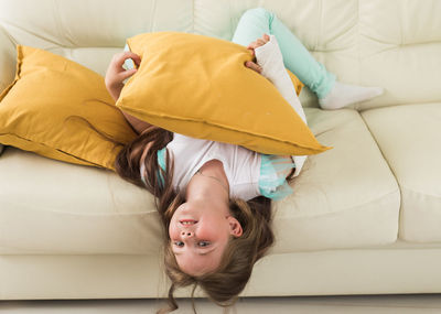 Portrait of boy sleeping on bed at home