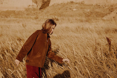 Side view of woman walking on land