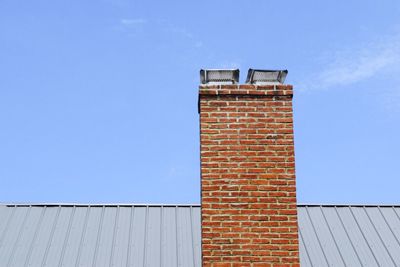 Low angle view of building against blue sky