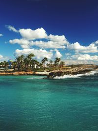 Scenic view of sea against blue sky