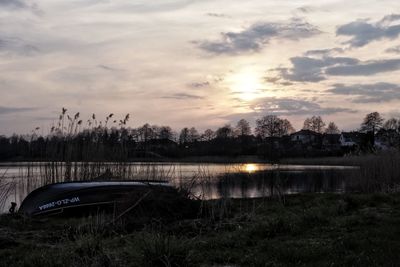 Scenic view of lake against sky during sunset