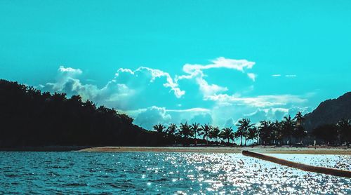 Scenic view of sea against blue sky