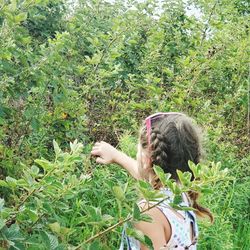 Rear view of girl on field