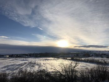 Scenic view of frozen lake against sky during winter