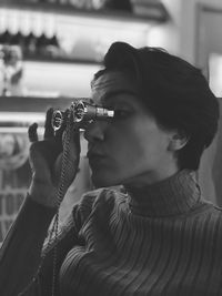 Woman looking through binoculars