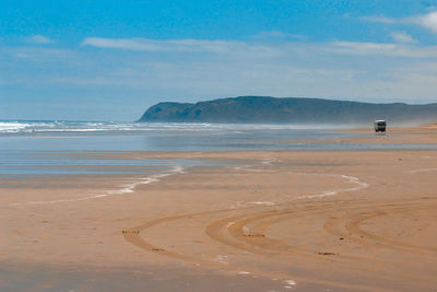 Scenic view of beach against sky