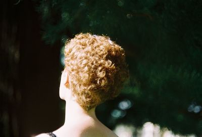Rear view of woman with short blond hair