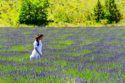 Full length of woman standing on field