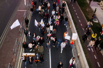 High angle view of people crossing road