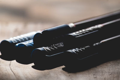 Close-up of pens on table