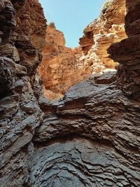 Low angle view of rock formation against sky