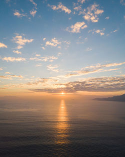 Scenic view of sea against romantic sky at sunset