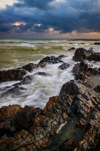 Scenic view of sea against sky during sunset