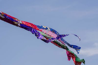 Low angle view of decoration hanging against sky