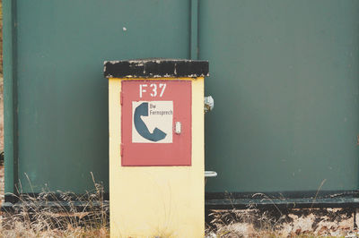 Close-up of warning sign on wall