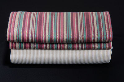 Close-up of colored pencils over black background