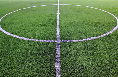White stripe on the green soccer field