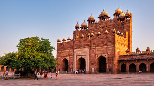 Group of people in front of historical building