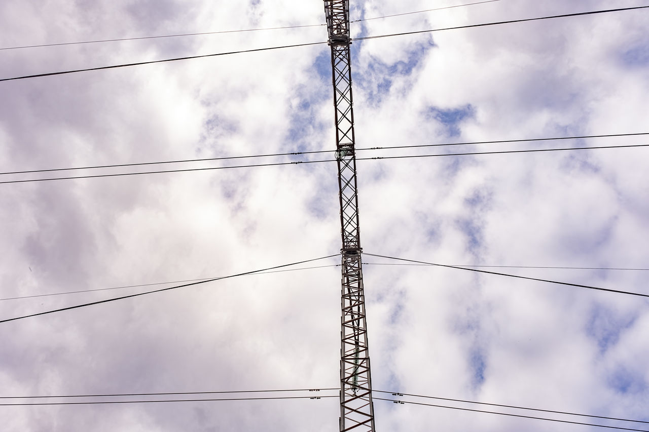 cable, electricity, cloud, power supply, power line, sky, technology, electricity pylon, power generation, low angle view, overhead power line, no people, nature, line, blue, day, outdoors, complexity, mast, outdoor structure, transmission tower, tower, architecture, built structure, electrical supply, telephone line