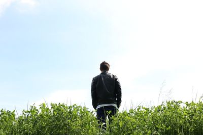 Full length of woman standing on tree trunk