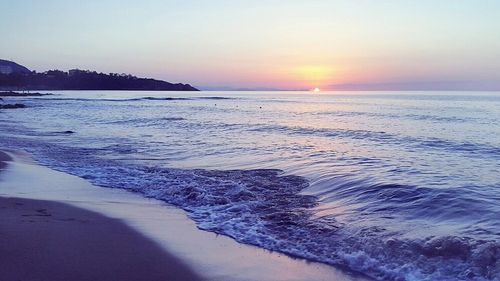 Scenic view of sea at sunset