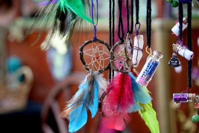 Close-up of multi colored dreamcatcher hanging for sale in market