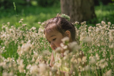 Portrait of cute girl on field