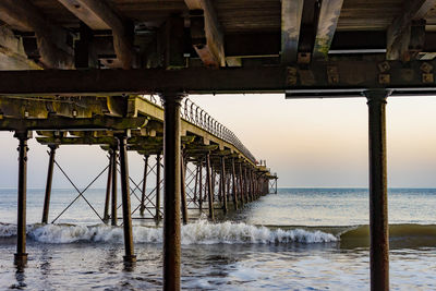 Pier over sea against sky