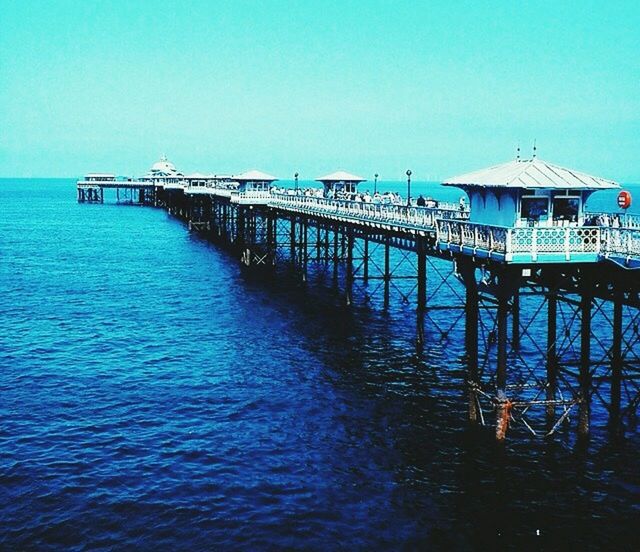 water, sea, clear sky, horizon over water, blue, copy space, pier, tranquil scene, tranquility, waterfront, beach, scenics, built structure, nature, beauty in nature, rippled, idyllic, jetty, sky, ocean