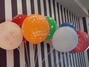 Low angle view of multi colored balloons