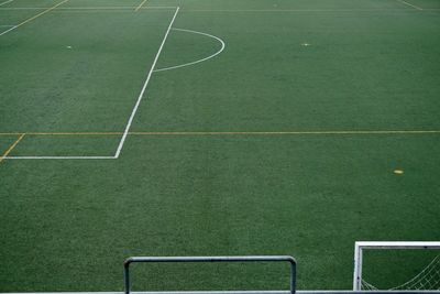 Empty soccer field, green grass in the stadium