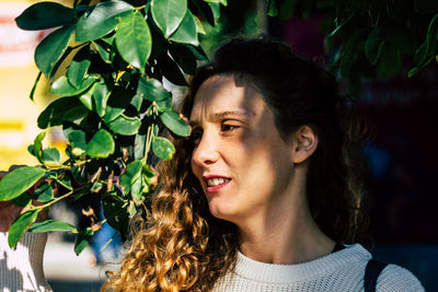 Portrait of smiling young woman looking away