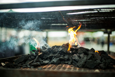 Close-up of bonfire on wood