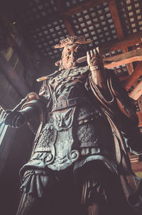 Low angle view of buddha statue