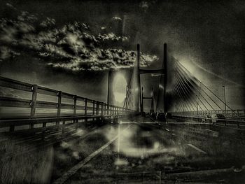 Bridge over road against sky