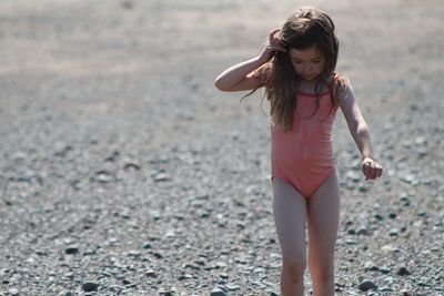 Full length of girl standing on beach