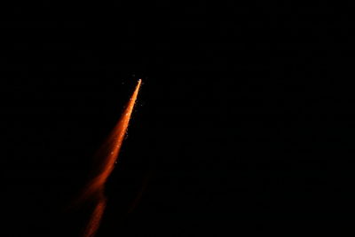 Airplane flying in sky at night