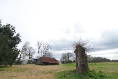 House on landscape against sky