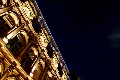 Low angle view of building against sky at night