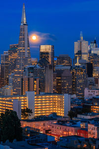 Illuminated buildings in city at night