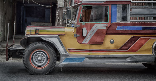 Vintage car parked on street in city