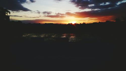 Scenic view of silhouette trees against sky during sunset