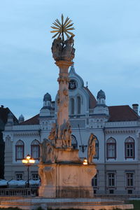 Low angle view of statue against building