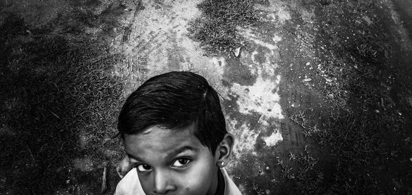 Portrait of teenage boy against wall