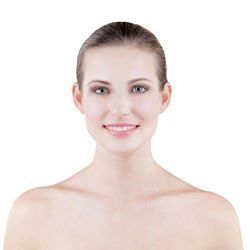 Portrait of smiling young woman against white background