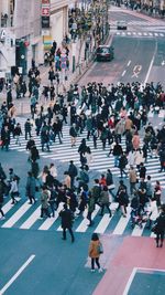 High angle view of people crossing road