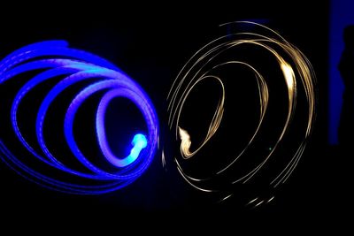 Close-up of light painting against black background