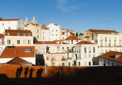 Town against clear blue sky